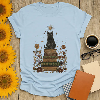 Mystic Cat & Books T-Shirt featuring a whimsical black cat on vintage books, perfect for cozy book lovers and gift giving.