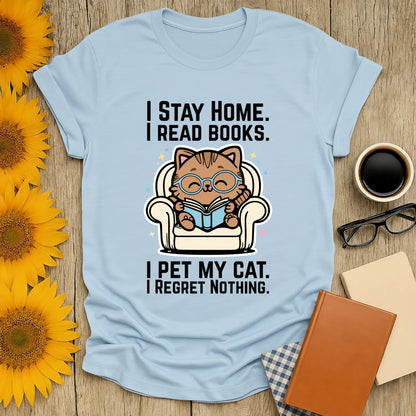 Starry Cat Reader T-Shirt featuring a whimsical cat in glasses reading on a couch, surrounded by stars. Perfect gift for book lovers.