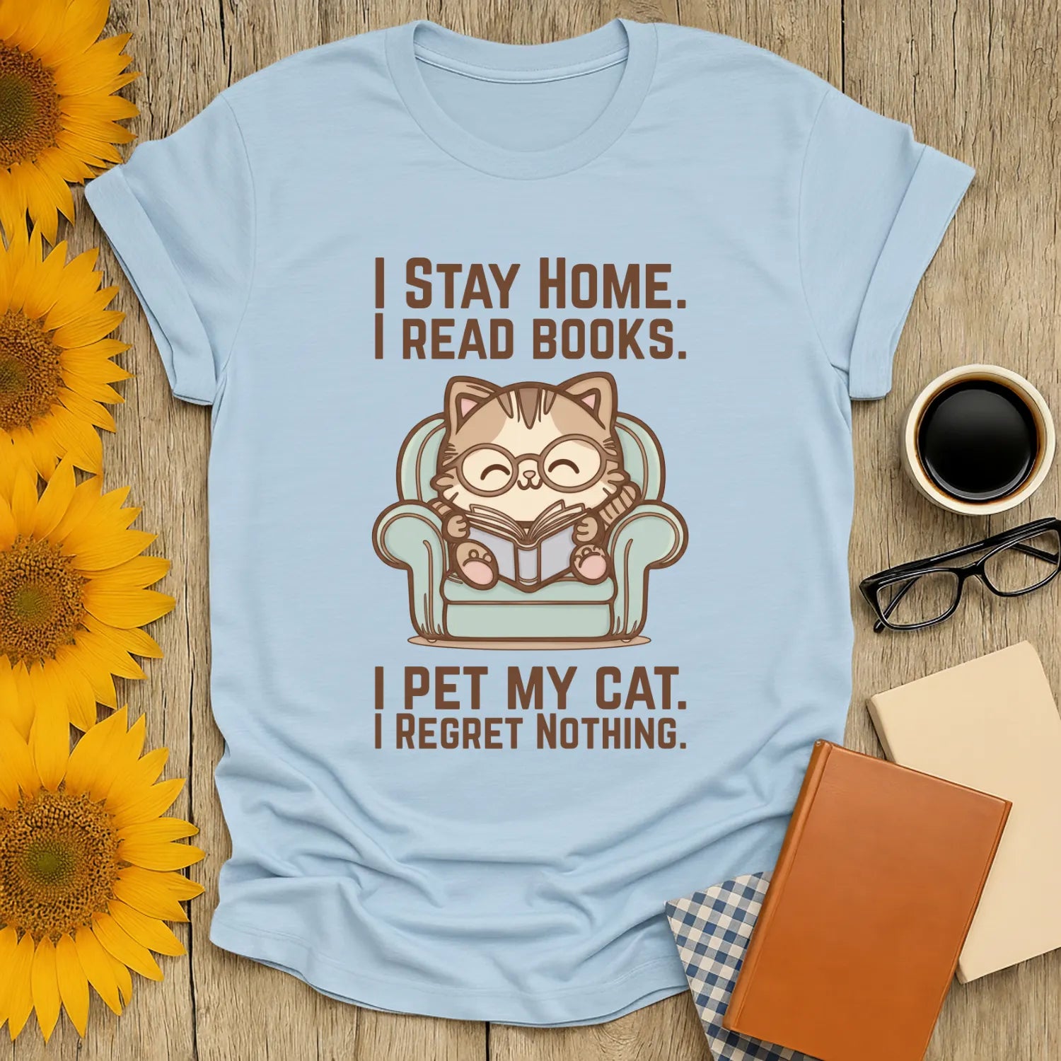 Comfy Cat Reader T-Shirt featuring a cute cat in glasses reading, with witty text about home and pets, perfect for book lovers.