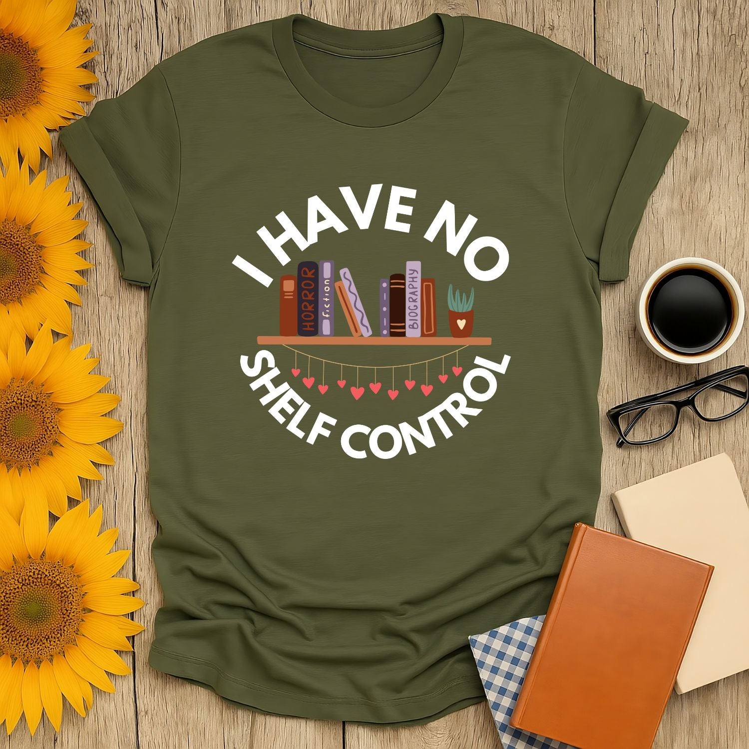 Cozy 'I Have No Shelf Control' T-shirt with playful book stack design, perfect gift for cat and book lovers.