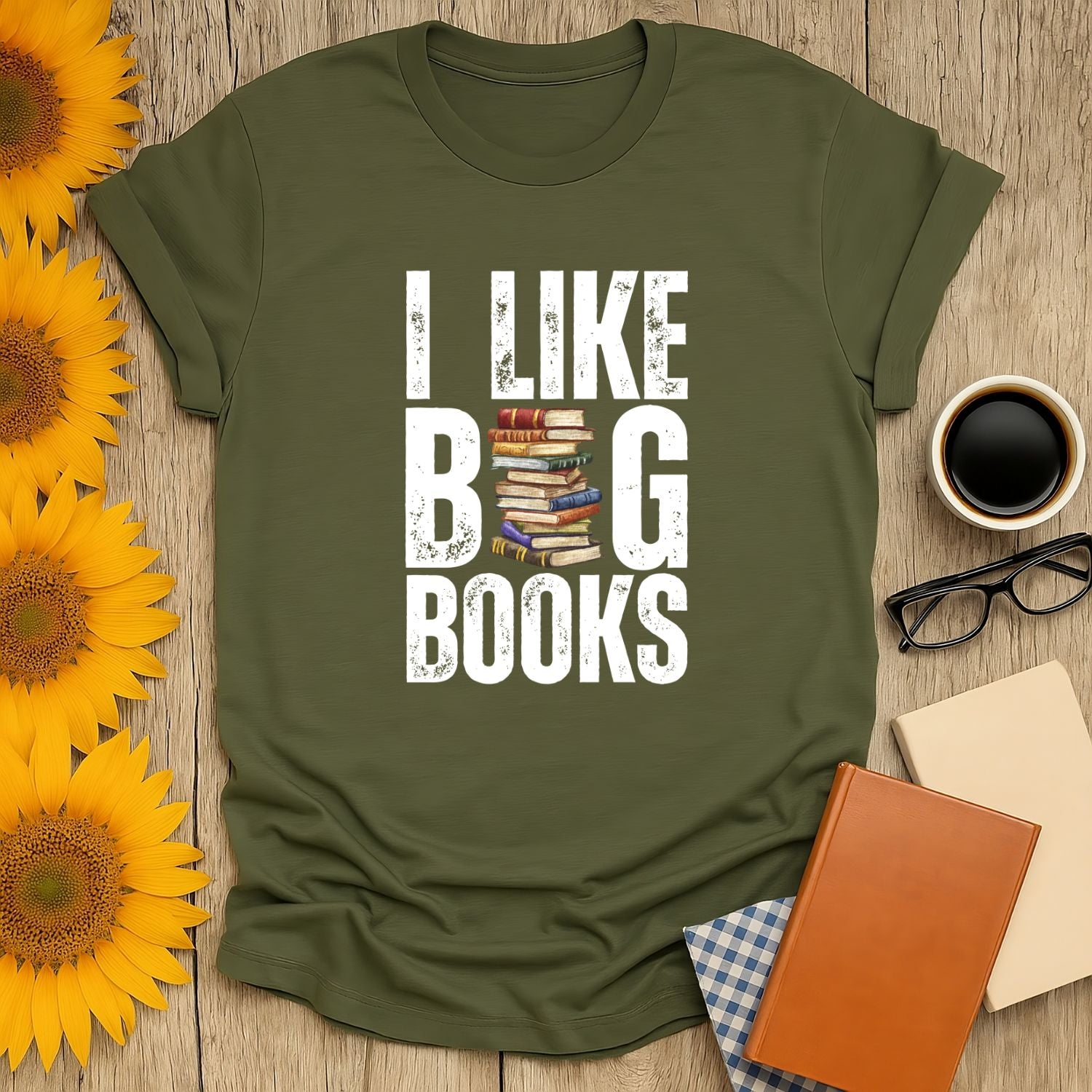 I like big books t-shirt on a rustic table with sunflowers, coffee, and cozy books—perfect for book lovers!