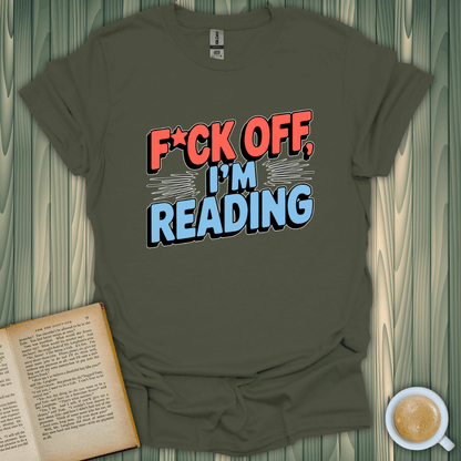 Funny unisex t-shirt reading 'F*CK OFF, I’M READING', perfect for book lovers, made of 100% cotton.