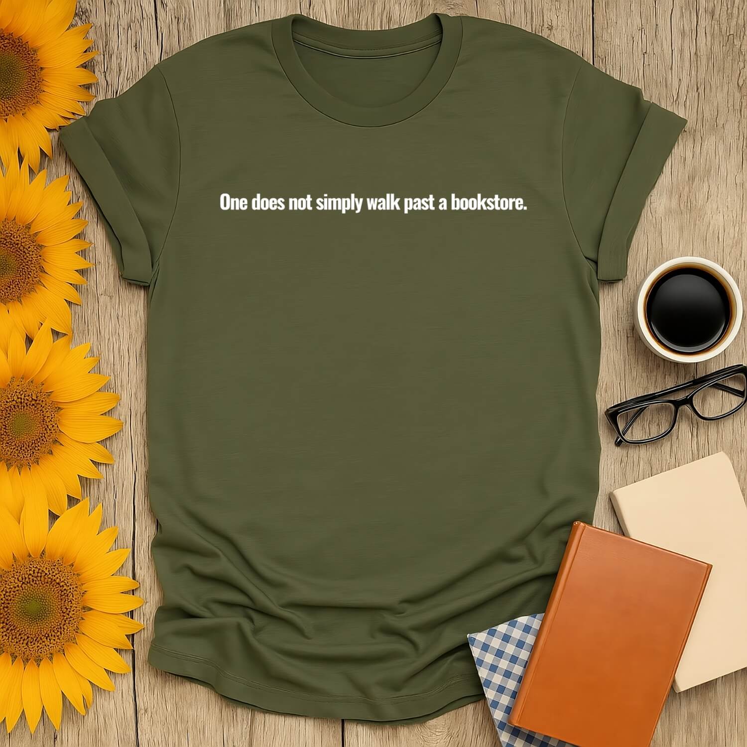 Bookstore Instinct T-Shirt in olive green with text: 'One does not simply walk past a bookstore.' Perfect for book lovers.