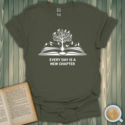 New Chapter Daily T-Shirt for book lovers, featuring a tree design and text on a soft green tee.