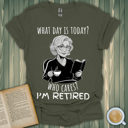 What Day is It? T-shirt featuring a playful retiree reading and sipping tea, perfect for book lovers.