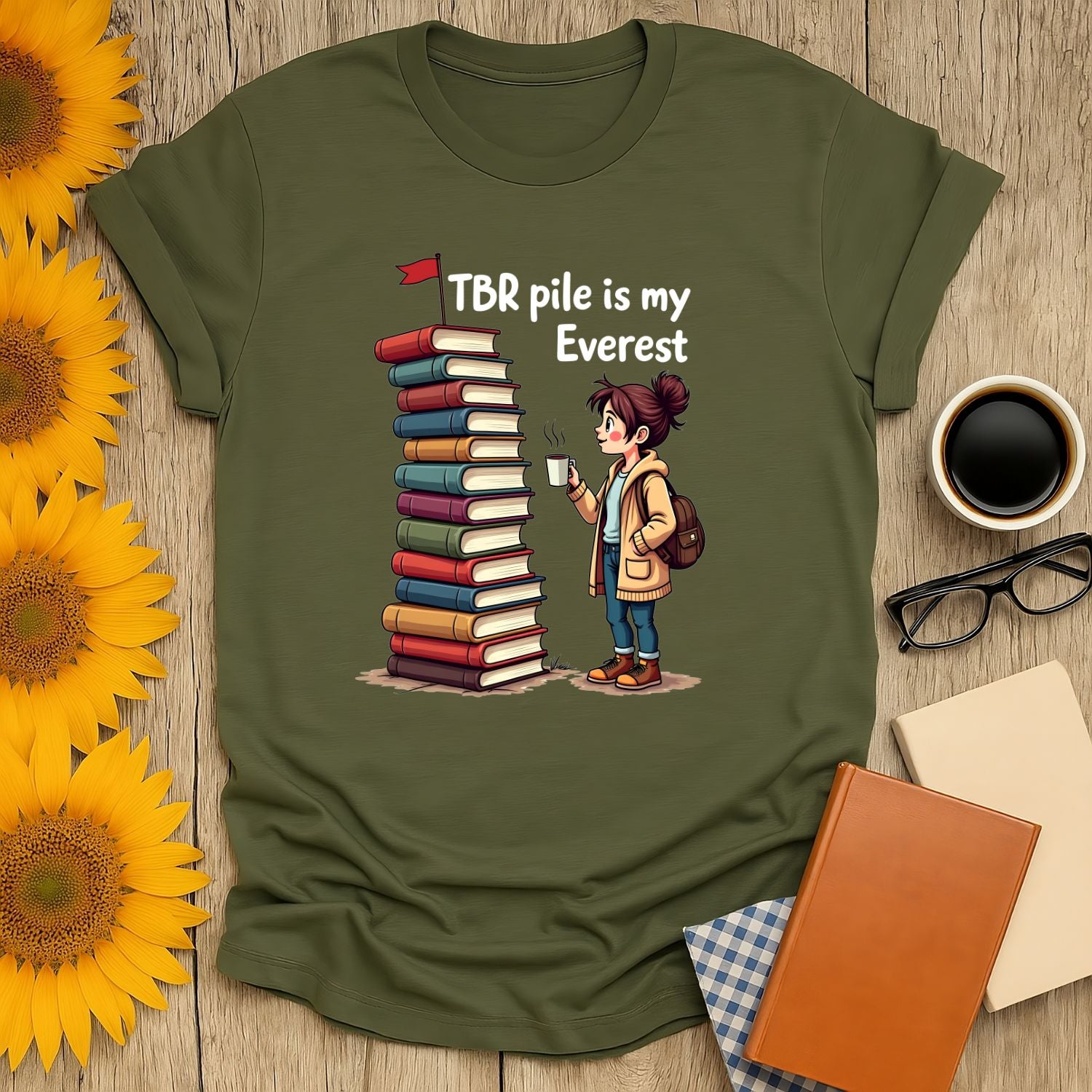 Bookish Everest T-Shirt featuring a girl with a TBR pile, ideal for book lovers, made of soft cotton.