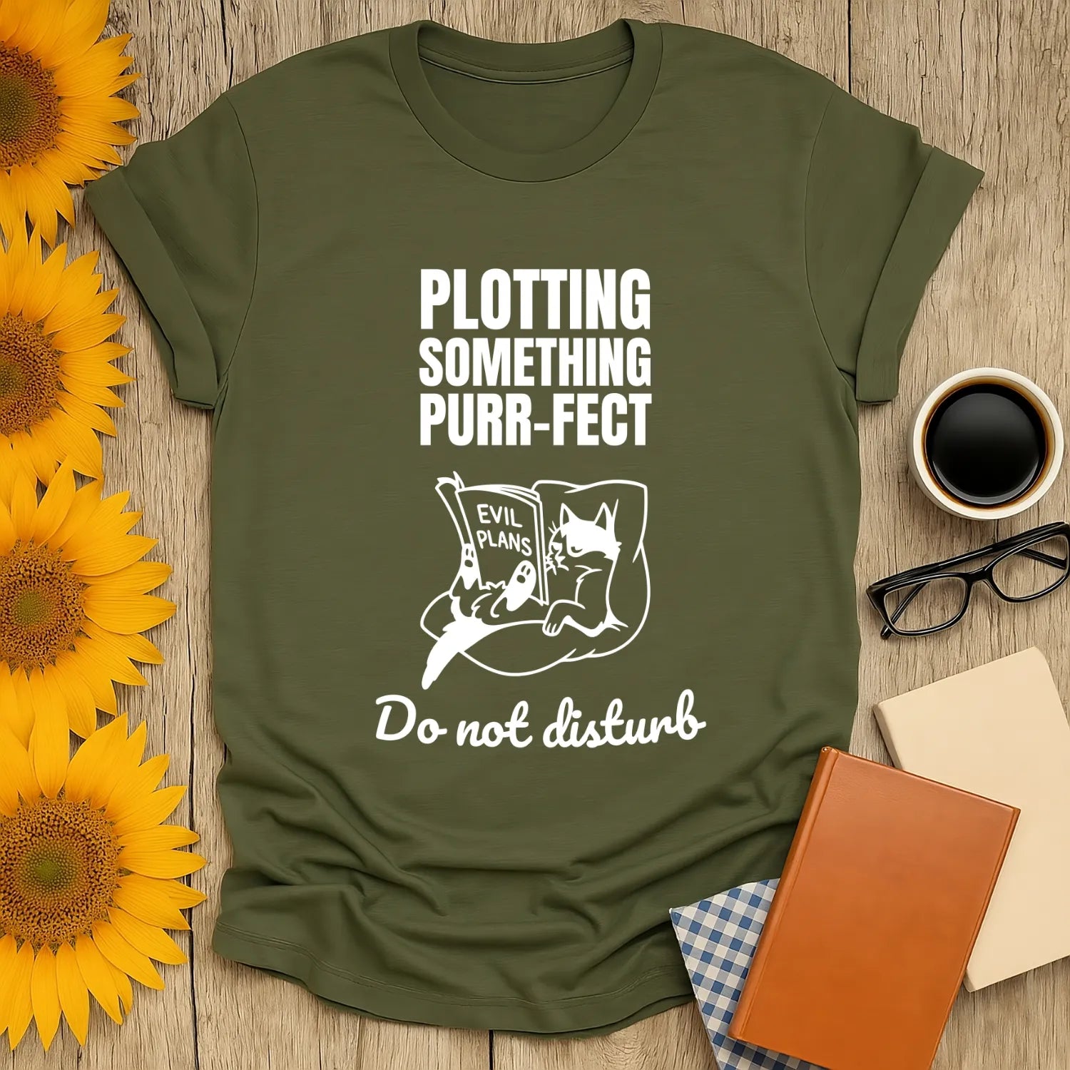 Funny reading tee featuring a cat with a book, saying 'Plotting Something Purr-fect. Do not disturb.' Perfect for book lovers.