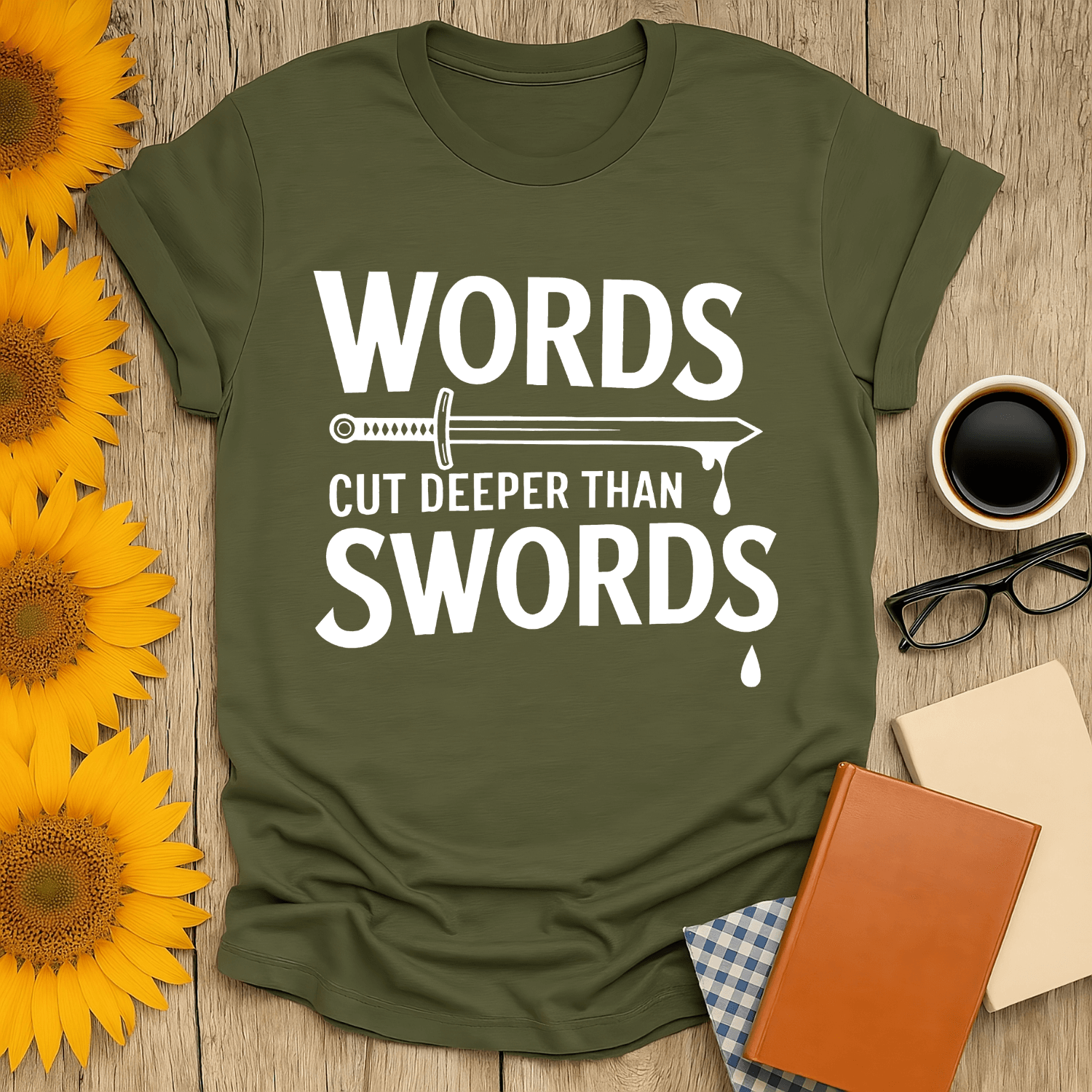 Words Cut Deeper Than Swords T-Shirt in olive green, perfect for book lovers, made from 100% ring-spun cotton.