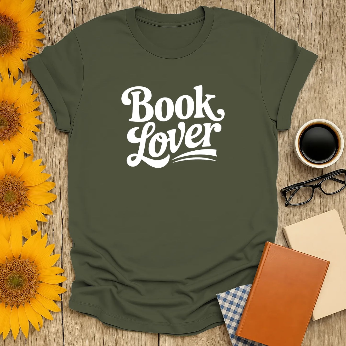 Book lover shirt in olive green with playful typography, perfect gift for readers who enjoy cats, coffee, or tea.