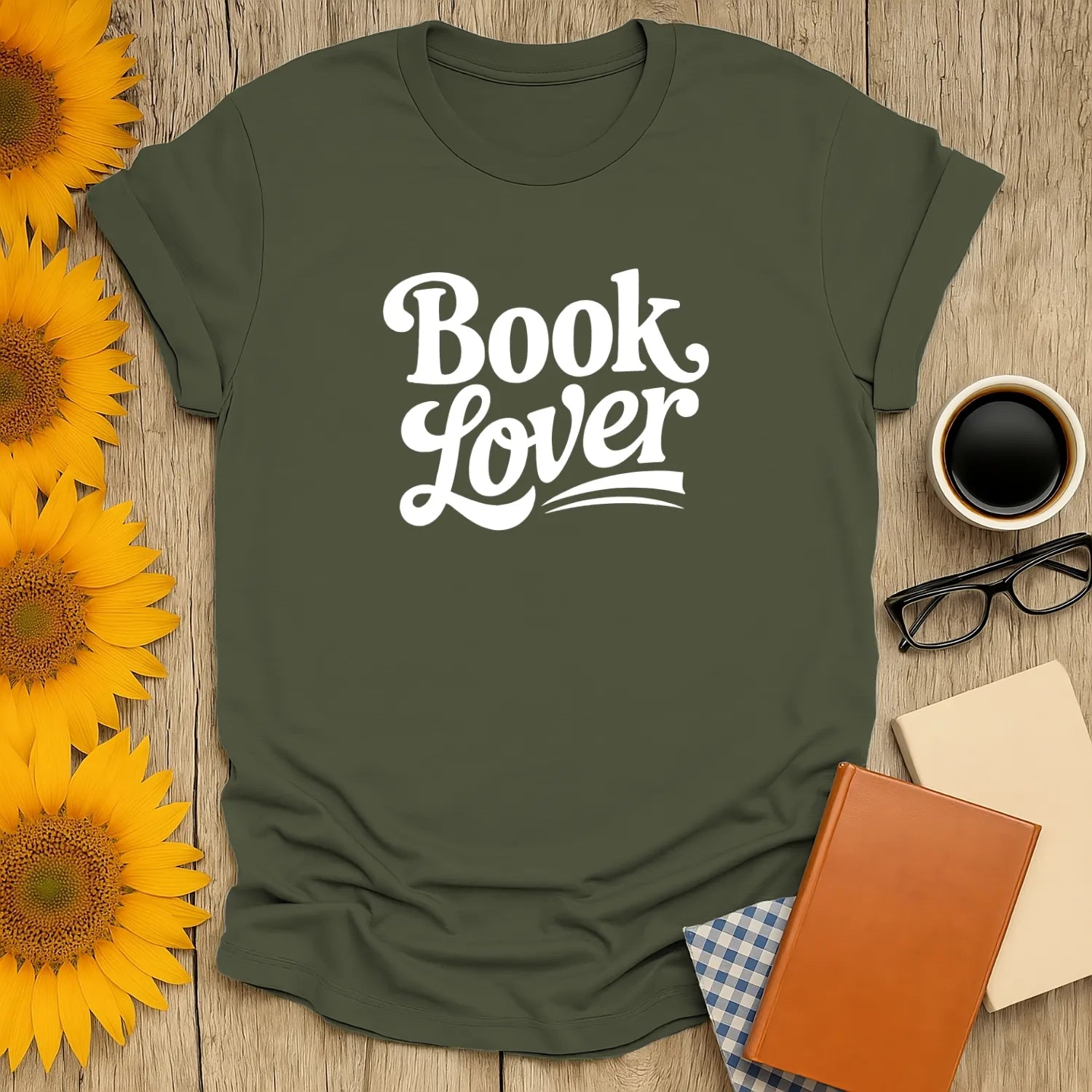 Book lover shirt in olive green with playful typography, perfect gift for readers who enjoy cats, coffee, or tea.