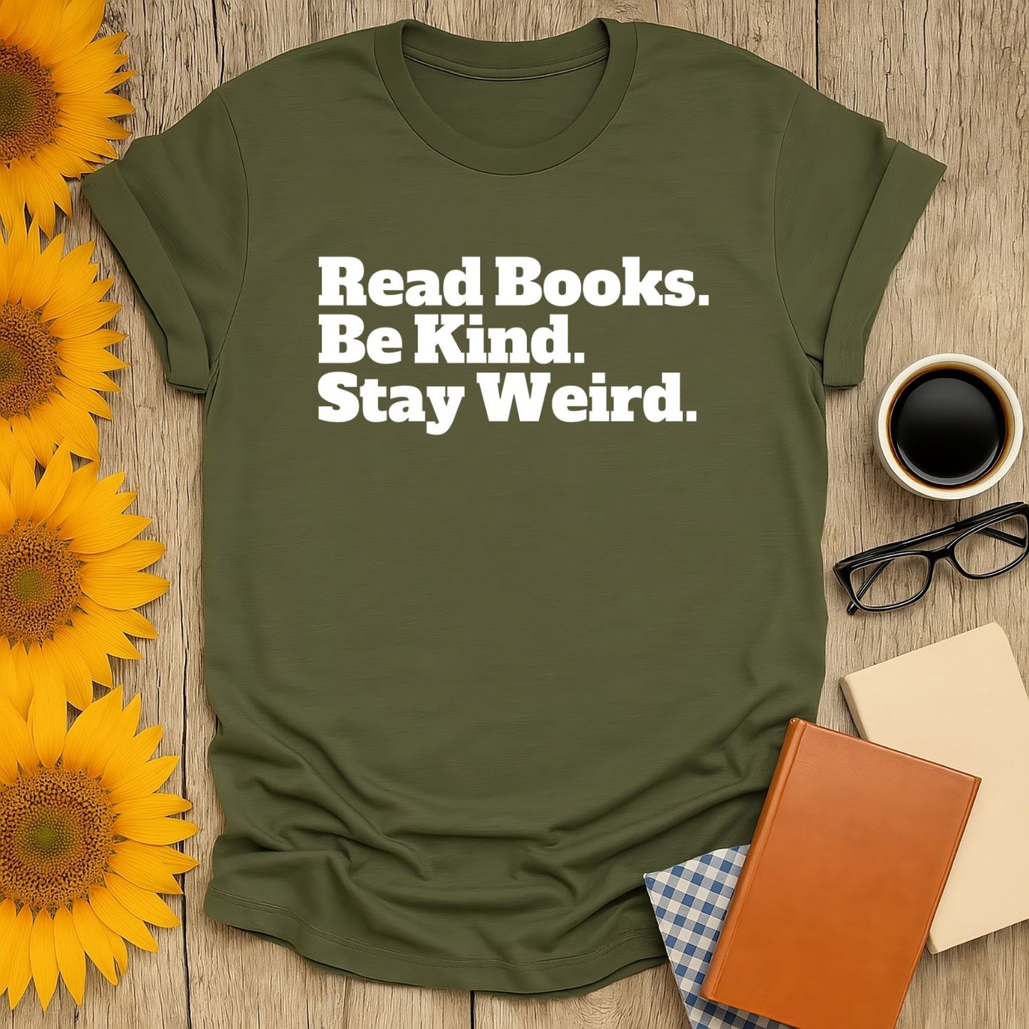 Olive green t-shirt with the text 'Read Books. Be Kind. Stay Weird.' Perfect for cat and coffee lovers. A cozy gift for bookworms!