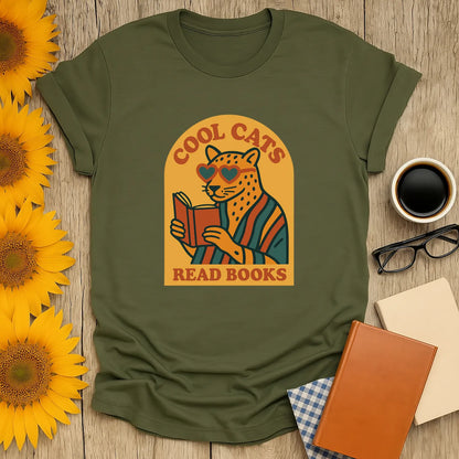 Retro-inspired 'Cool Cats Read Books' shirt featuring a cat in heart-shaped sunglasses with a book, perfect for book lovers.