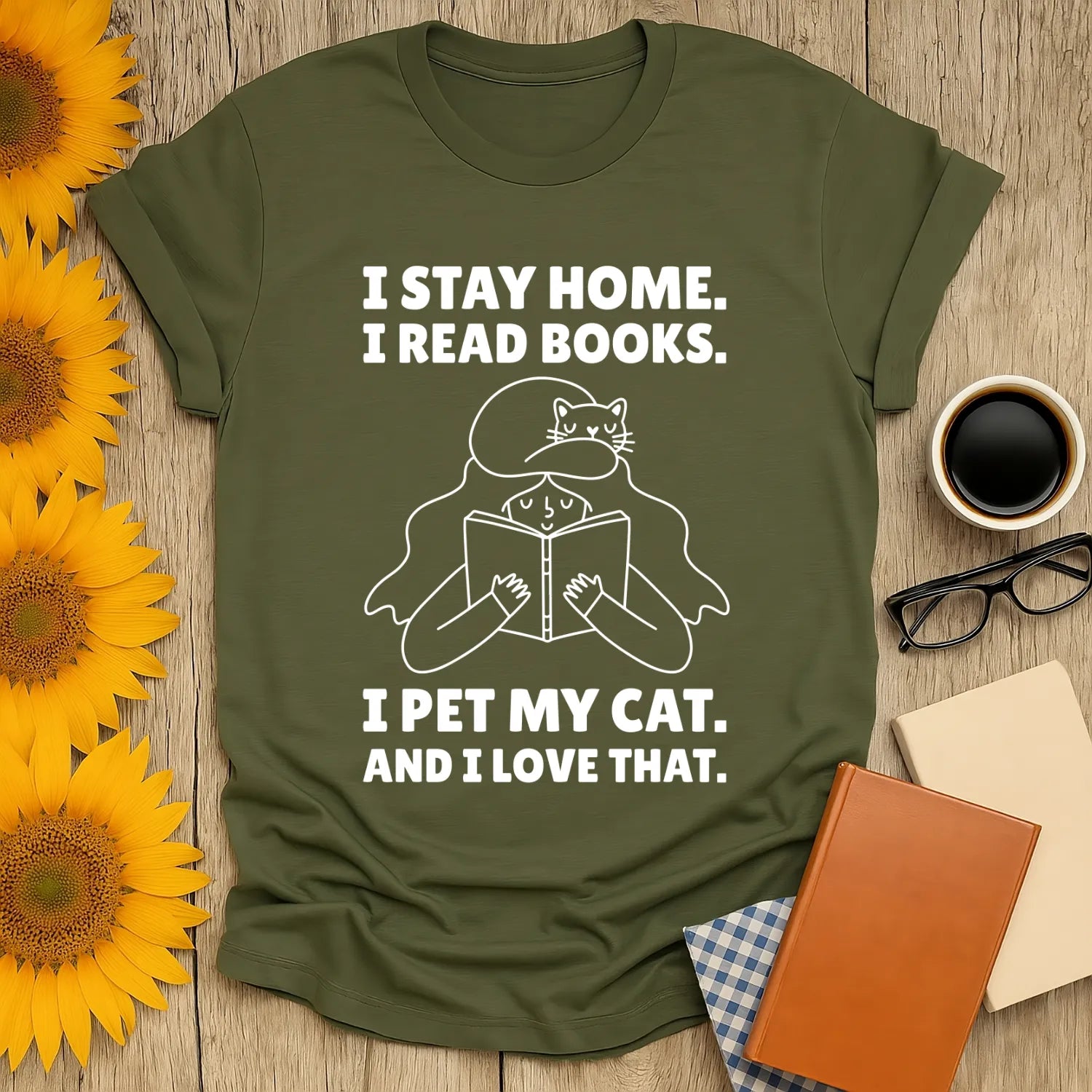 Cozy book lover shirt featuring cat and open book with text: I stay home, I read books, I pet my cat, and I love that.