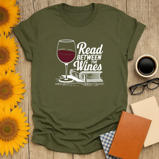 Unisex Read Between the Wines T-Shirt featuring a wine glass and book design, perfect for book lovers.