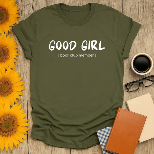 Good Girl book club member shirt on cozy backdrop with sunflowers, perfect gift for book lovers who enjoy cats, coffee, or tea.
