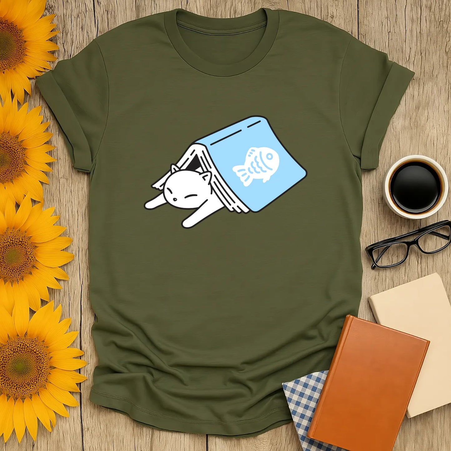 Cozy shirt with a cat hiding in a book, featuring a fish print; perfect for book lovers and cat enthusiasts.
