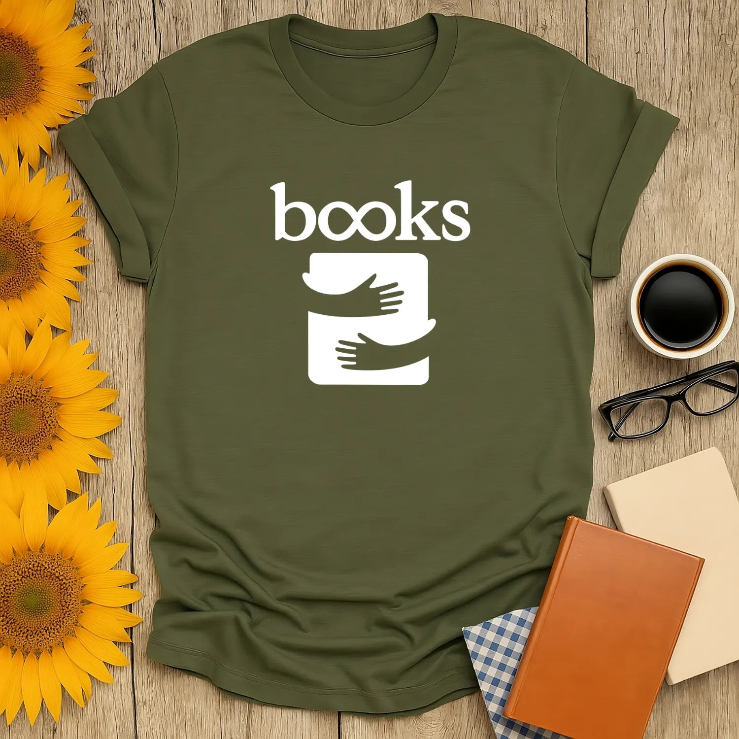 Cozy book lover shirt with the word 'books' and playful hands embracing an open book, perfect for readers who enjoy tea or coffee.