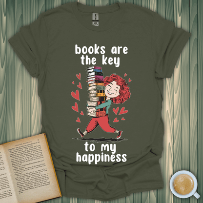 Key to My Joy t-shirt design featuring a happy person with stacked books and text 'books are the key to my happiness'