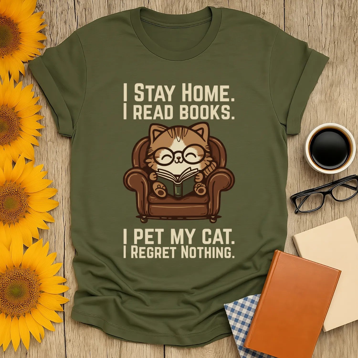 Armchair Cat Reader T-Shirt featuring a cozy cat in glasses reading on an armchair, perfect for book lovers and cat enthusiasts.