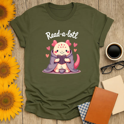Cute illustration of a cozy creature reading with the text 'Read-a-lotl'—perfect book lover shirt for cat or tea fans!