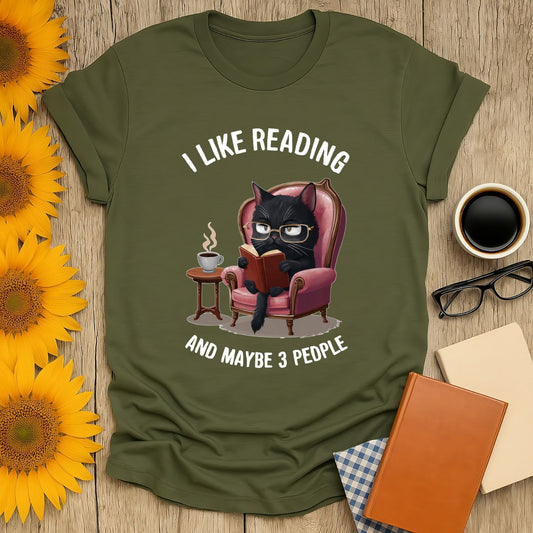 I Like Reading & Maybe 3 People T-Shirt for book lovers, featuring a cat reading in a cozy chair, 100% ring-spun cotton.