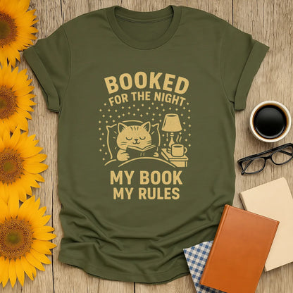Cozy 'Booked for the Night' shirt featuring a cat, book, and text for book lovers. Perfect gift for cat and coffee fans!