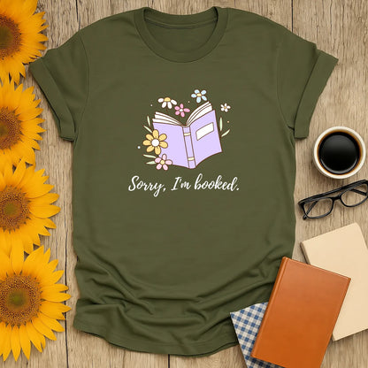 Sorry, I’m Booked T-Shirt featuring a pastel book design; perfect cozy reading outfit for book lovers. 🌸📖