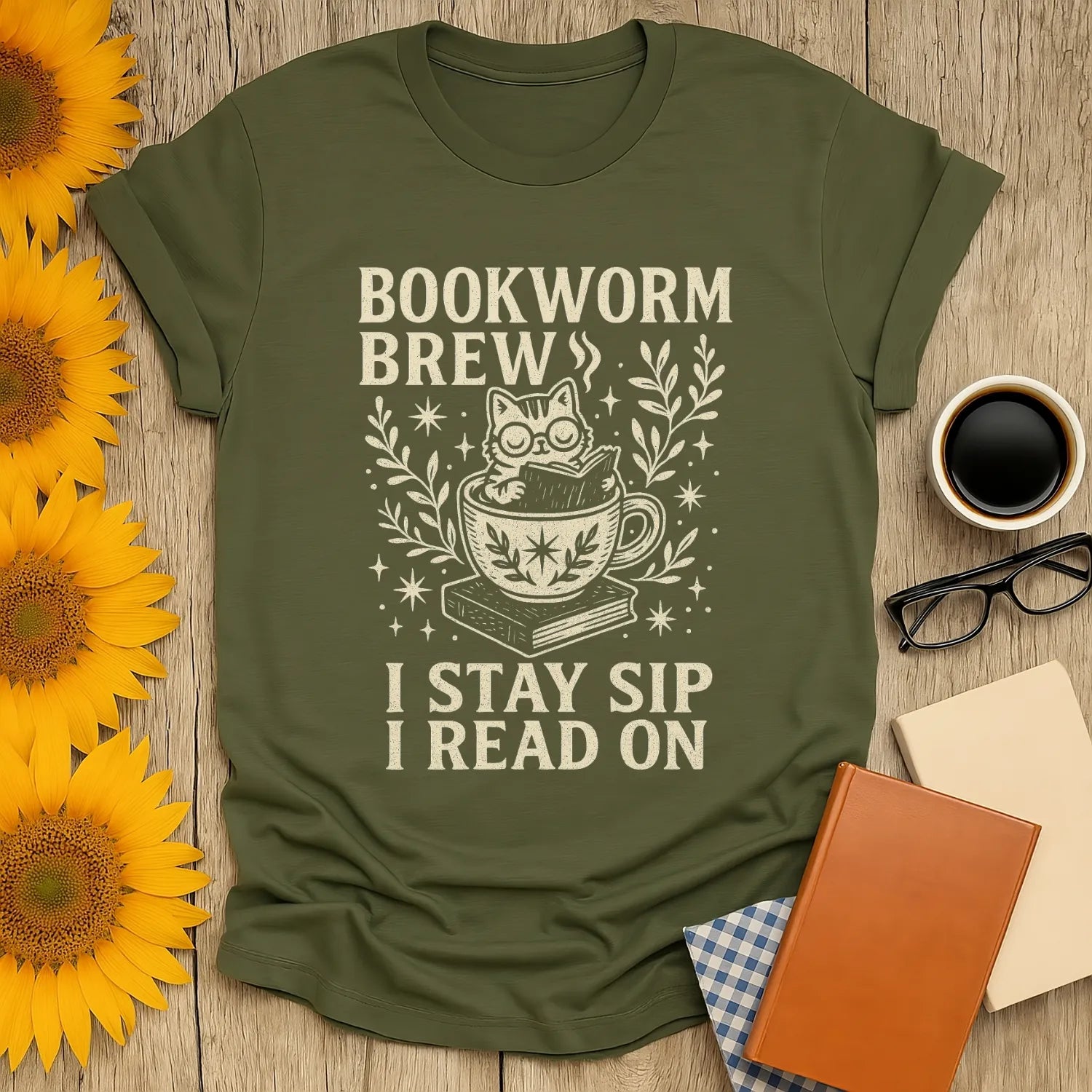Bookworm Brew T-shirt featuring a cute cat in a teacup with text 'I STAY SIP I READ ON'—the perfect cozy gift for book lovers!
