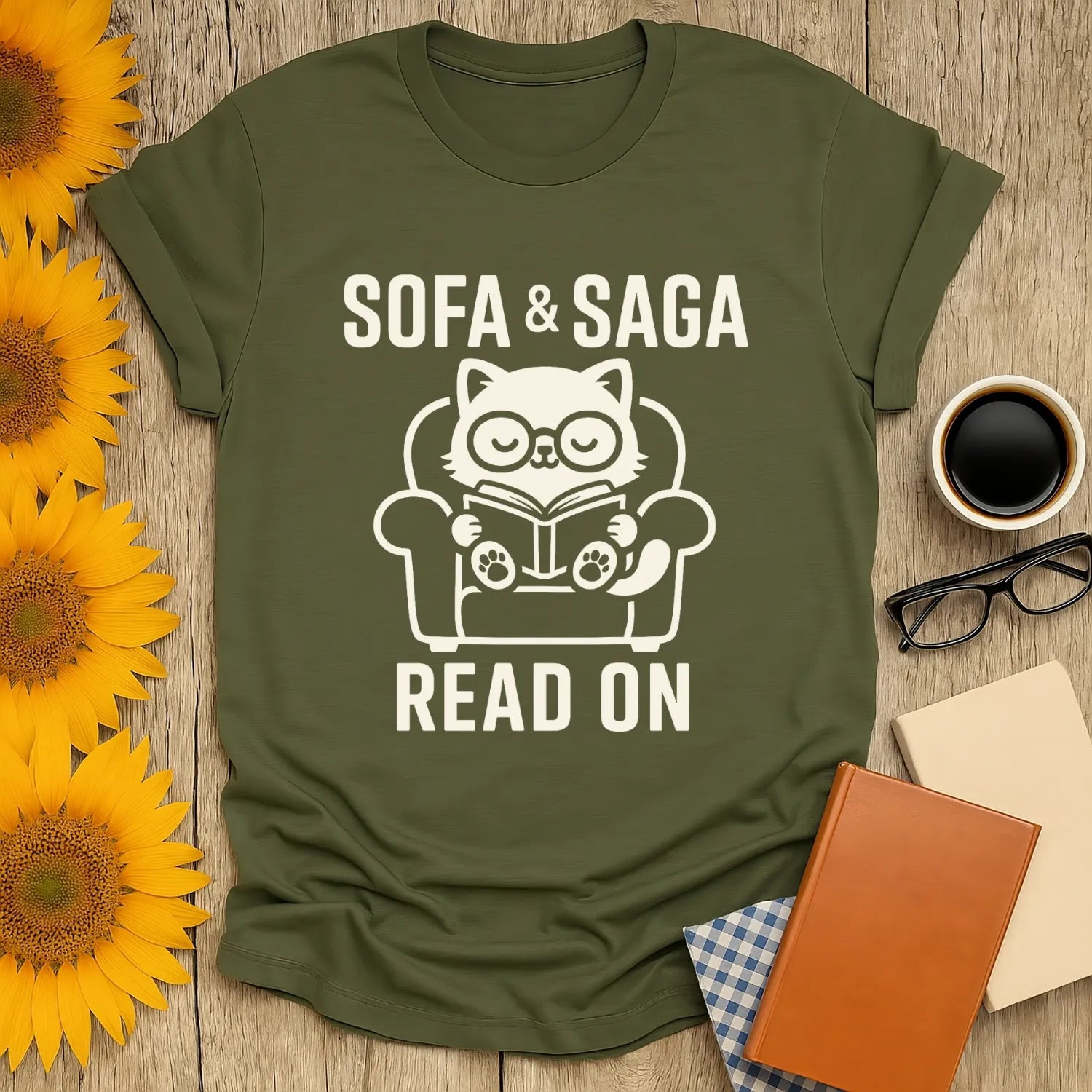 Cozy cat reading on a chair with text 'Sofa & Saga' and 'Read On' - perfect funny book lover shirt for comfy moments.
