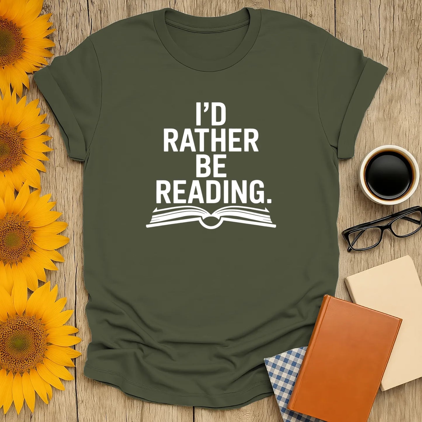Cozy green tee with 'I’d Rather Be Reading' text and open book illustration, perfect for book lovers and gift giving.