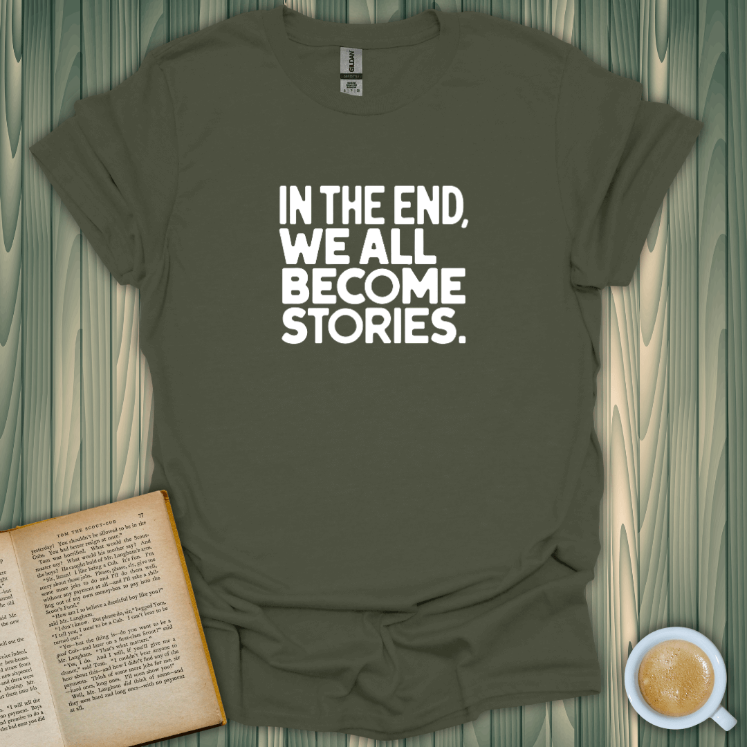 We All Become Stories T-Shirt in olive green, perfect for book lovers, made of soft, breathable cotton.