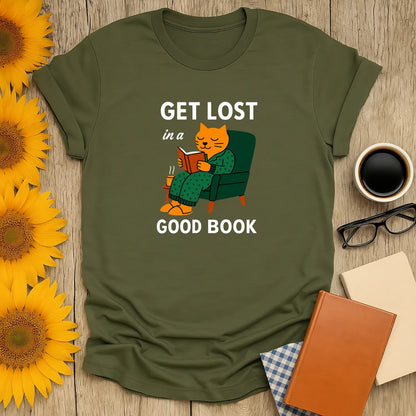 Cozy cat reading t-shirt featuring a sleepy cat in a chair, text reads 'Get Lost in a Good Book' for book lovers.
