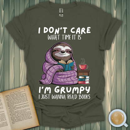 Grumpy sloth book lover t-shirt featuring a cozy sloth reading with a cup of coffee, perfect for book enthusiasts.