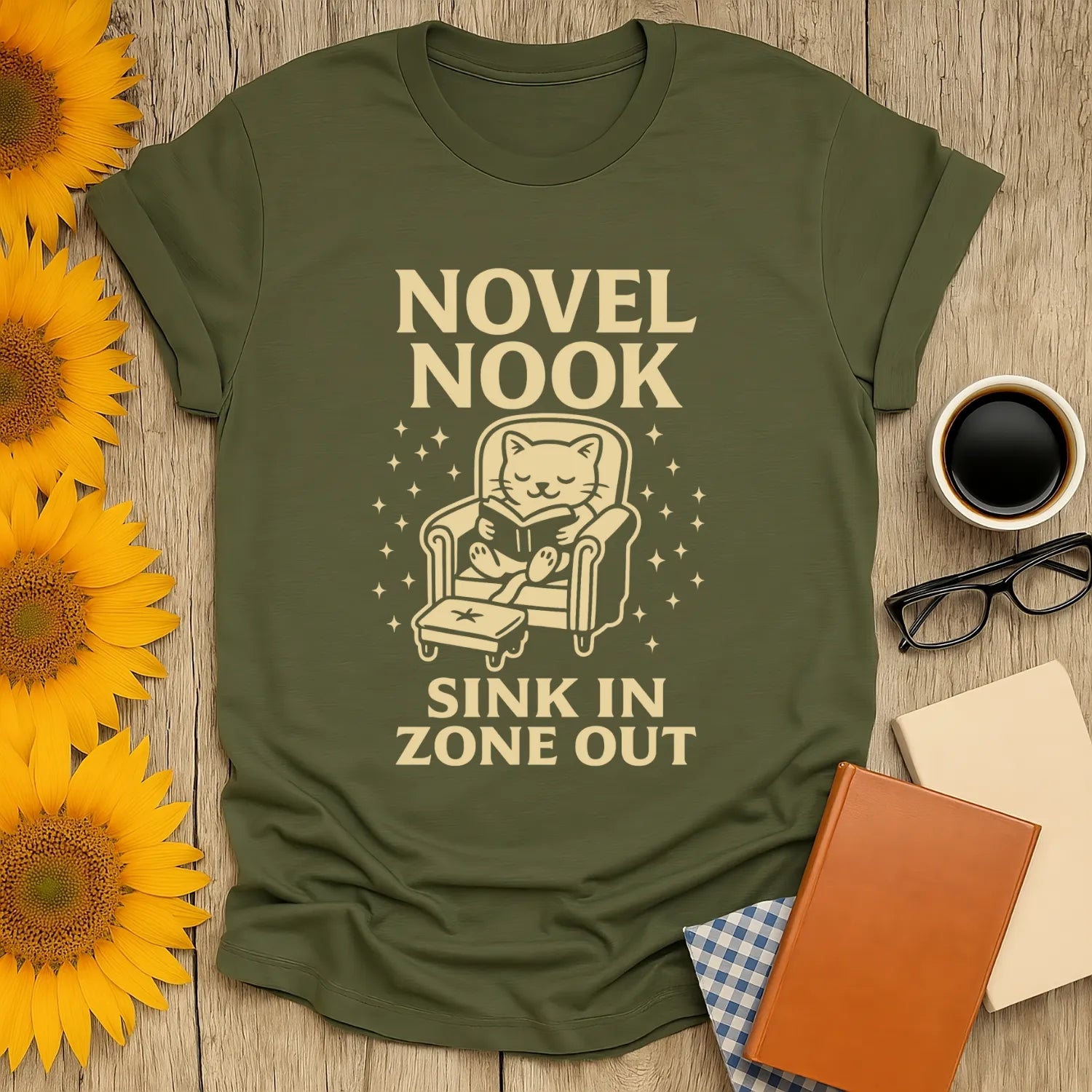 Cozy Novel Nook t-shirt featuring a cat reading, perfect for book lovers who enjoy a good tea or coffee break.