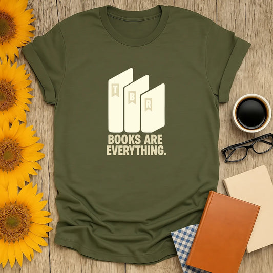 Book lover shirt featuring 'Books Are Everything' with stylish book graphic, perfect for cozy reading with coffee or tea.