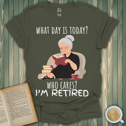 Humorous 'What Day is It?' t-shirt for book lovers featuring an elderly woman reading while retired.