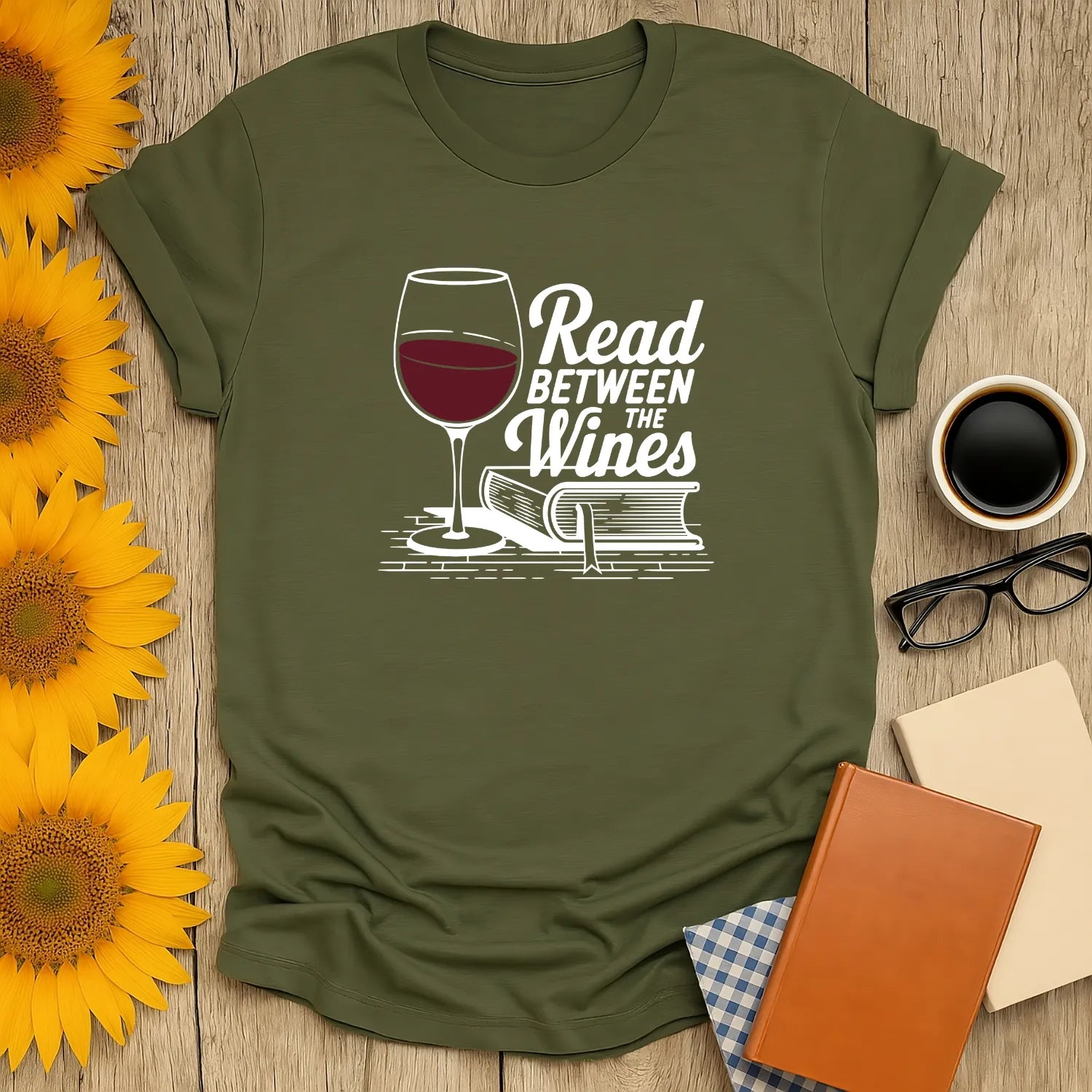 Relaxed fit unisex Read Between the Wines T-Shirt featuring wine glass & book illustration, perfect cozy gift for book lovers 📖.