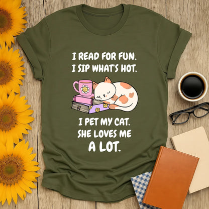 Cozy book lover shirt with a playful cat drinking tea, perfect gift for readers and cat enthusiasts.