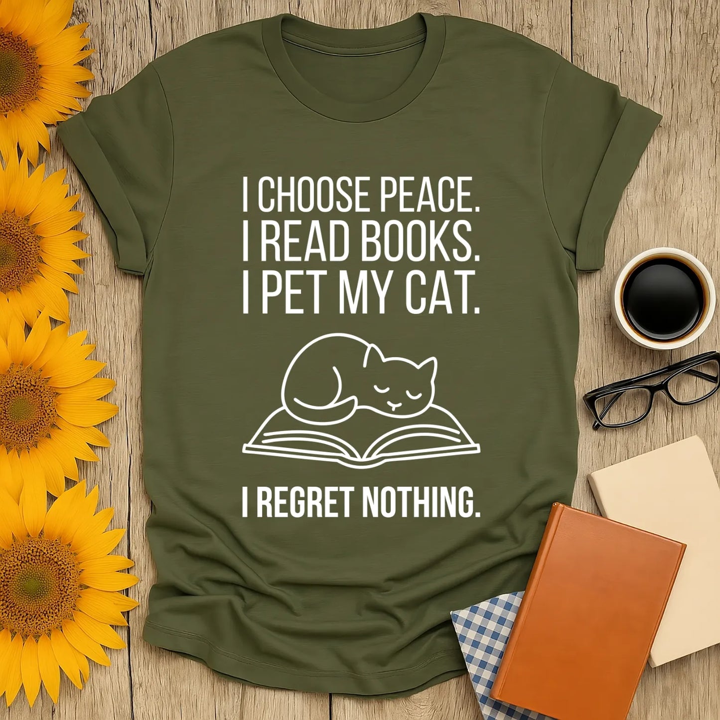 Unisex t-shirt for book lovers featuring a cat on an open book with text: 'I choose peace. I read books. I pet my cat. I regret nothing.'