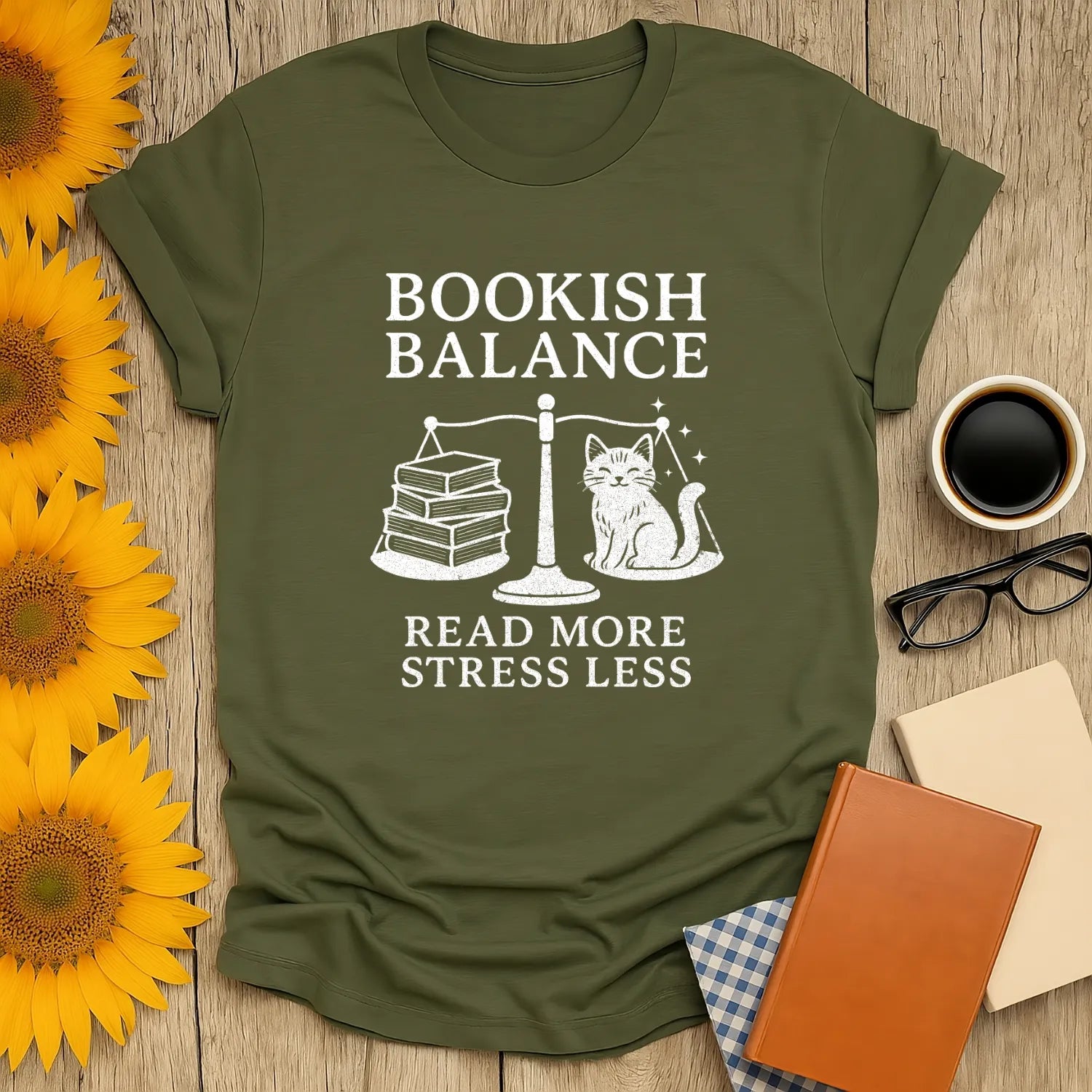 Bookish Balance T-Shirt featuring a cat and stacked books, promoting reading over stress—perfect for book lovers.