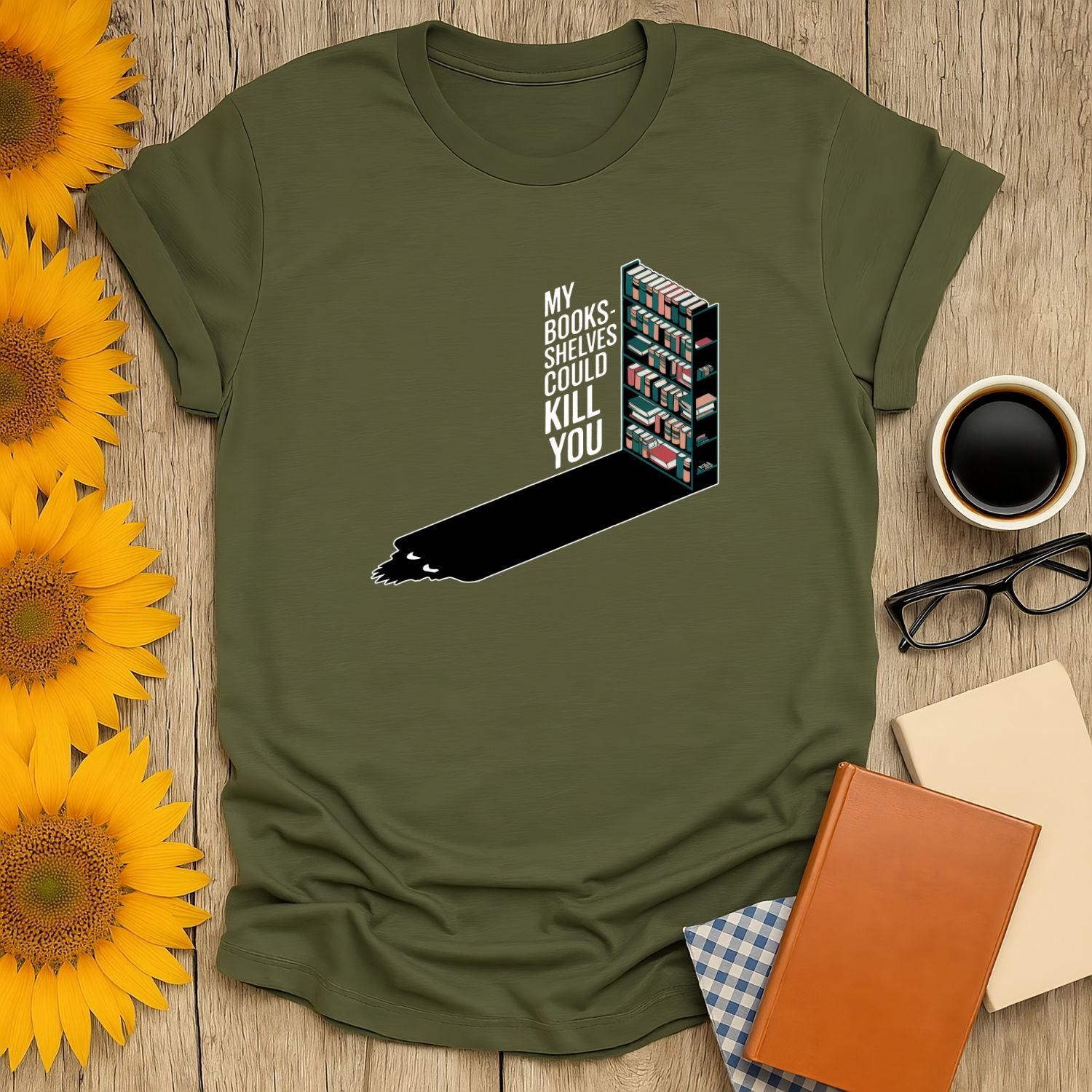 Deadly Bookshelves T-Shirt with humorous text and book shelf graphic, perfect gift for cozy readers who love cats and coffee.