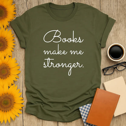 Cozy olive green book lover shirt with text 'Books make me stronger,' surrounded by sunflowers and reading essentials.