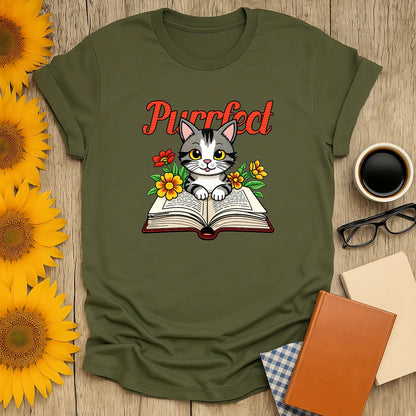 Purrfect Page T-Shirt: cute kitten on an open book with flowers; ideal for cat lovers and bookworms.