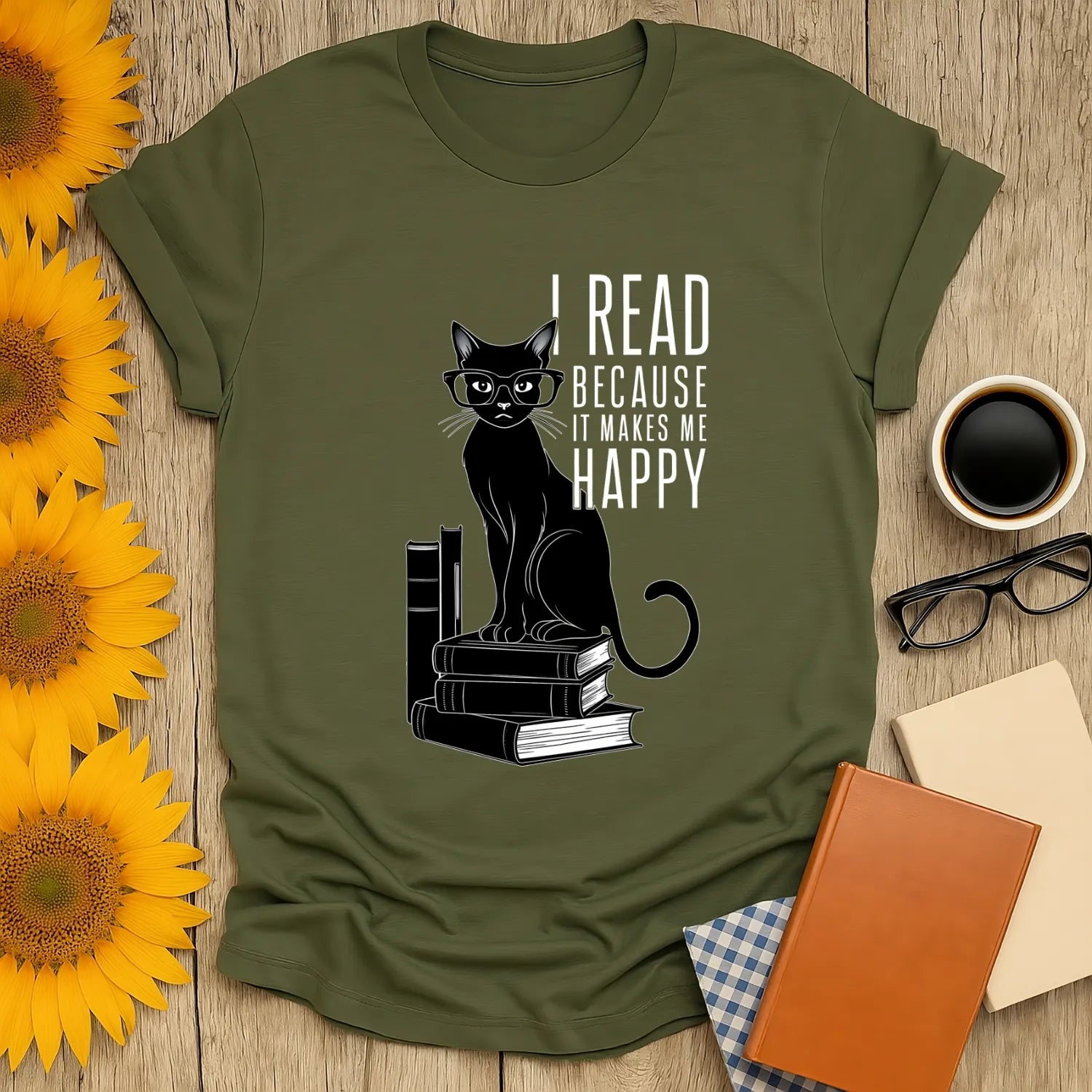 Cozy book lover shirt featuring a playful black cat with glasses on books, captioned 'I read because it makes me happy'.