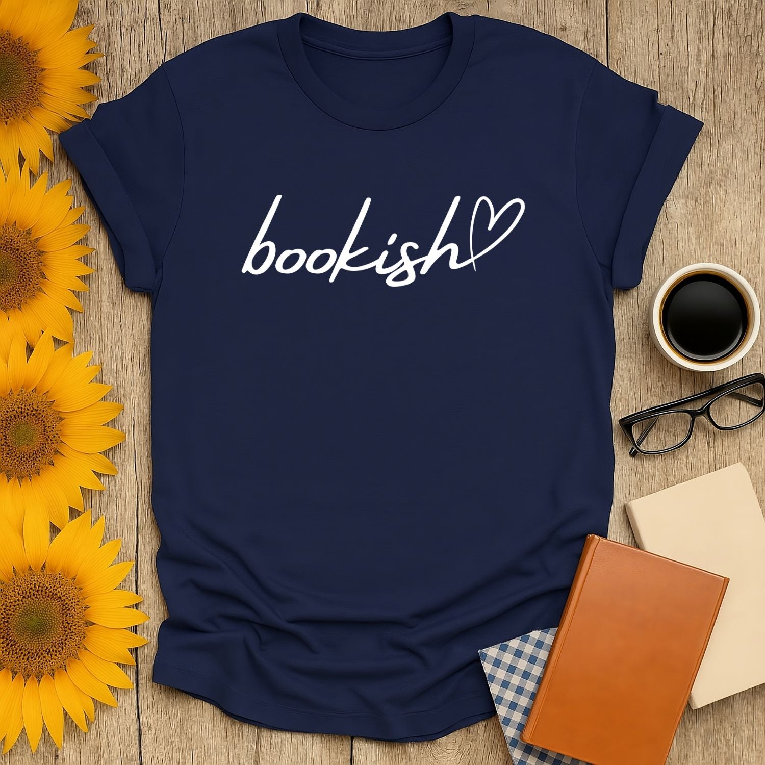 Navy blue t-shirt with 'bookish' text and heart, perfect cozy gift for cat-loving, coffee-sipping bookworms.