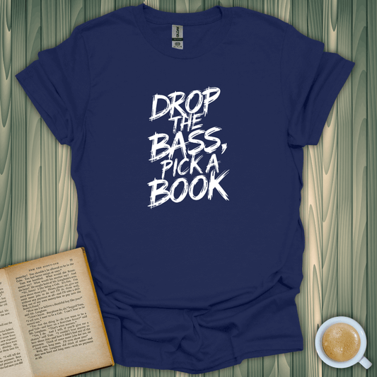 Drop Bass, Pick Book T-Shirt on wooden table; perfect for book lovers. Fun design in navy blue, 100% cotton.