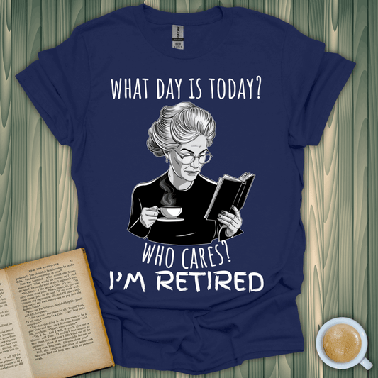 Navy blue "What Day is Today?" T-shirt featuring a cheerful retired woman reading, perfect for book lovers.