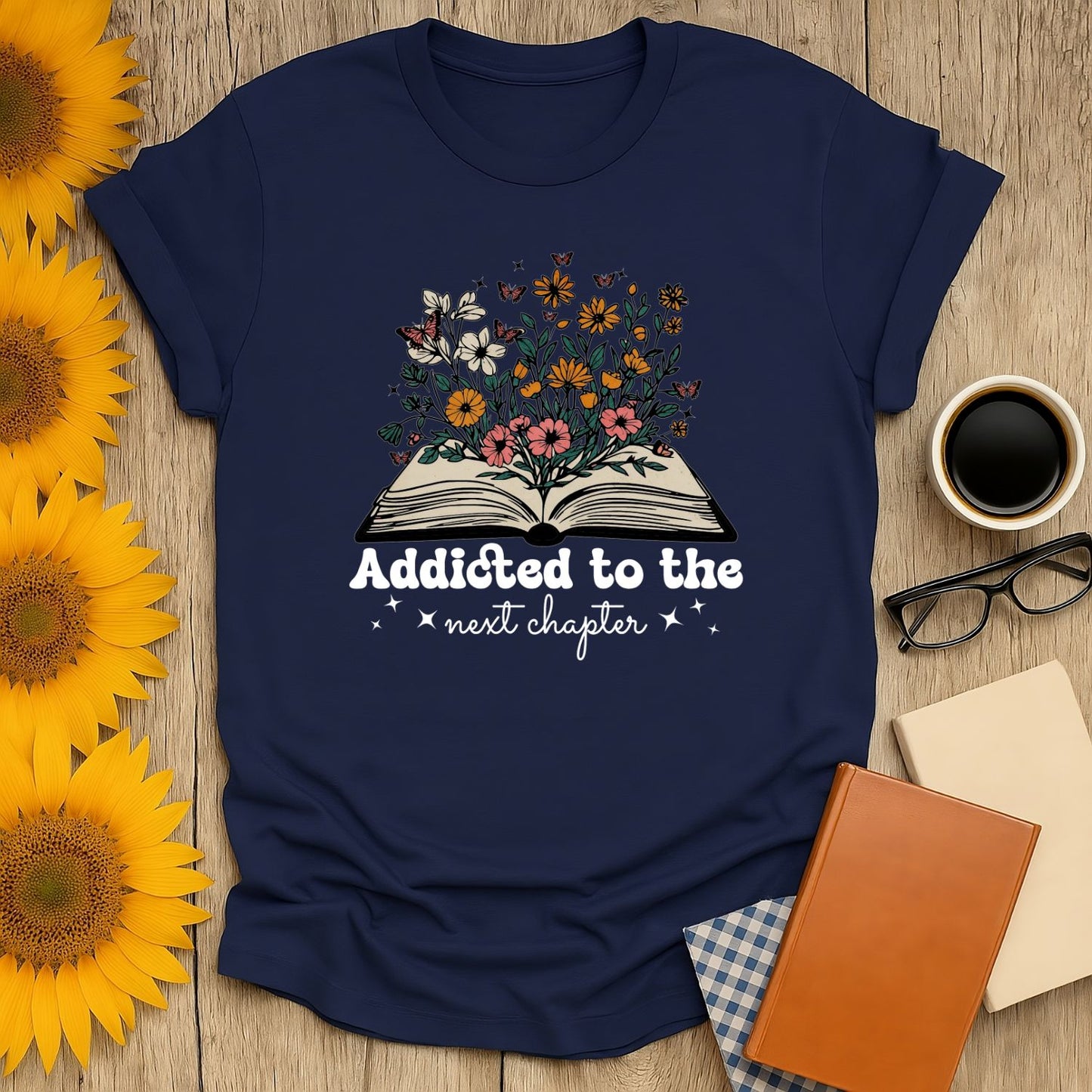 Navy blue 'Addicted to the next chapter' shirt with floral book illustration, perfect gift for cat and coffee-loving bookworms.