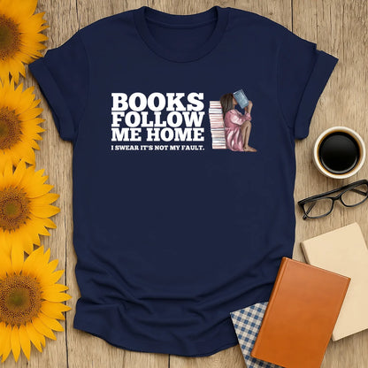 Navy book lover shirt featuring a seated woman and text "Books Follow Me Home"—a cozy gift for bookworms, coffee & cat lovers.