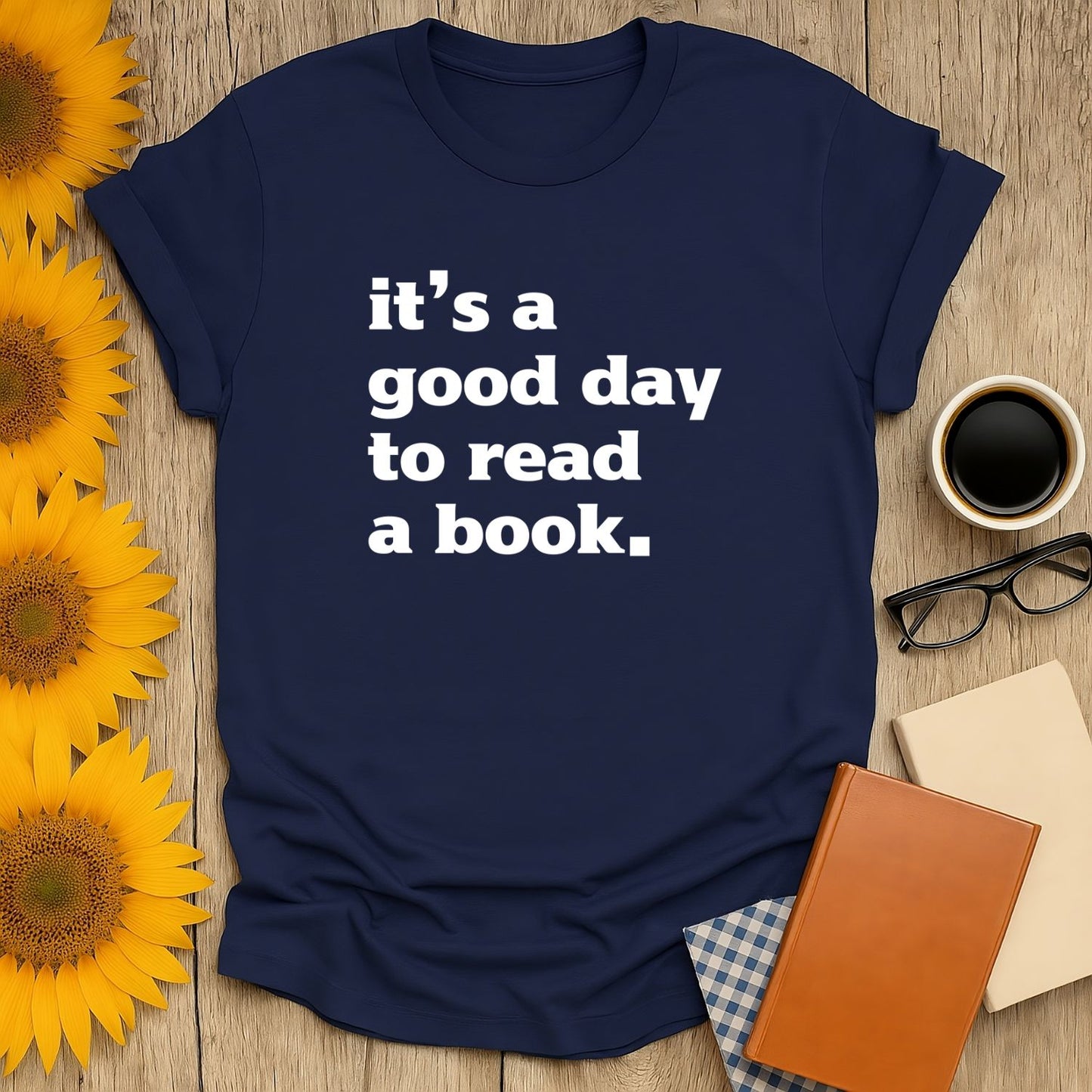 Cozy navy t-shirt with bold white text: 'it's a good day to read a book.' Perfect gift for book lovers, cats, coffee, or tea.